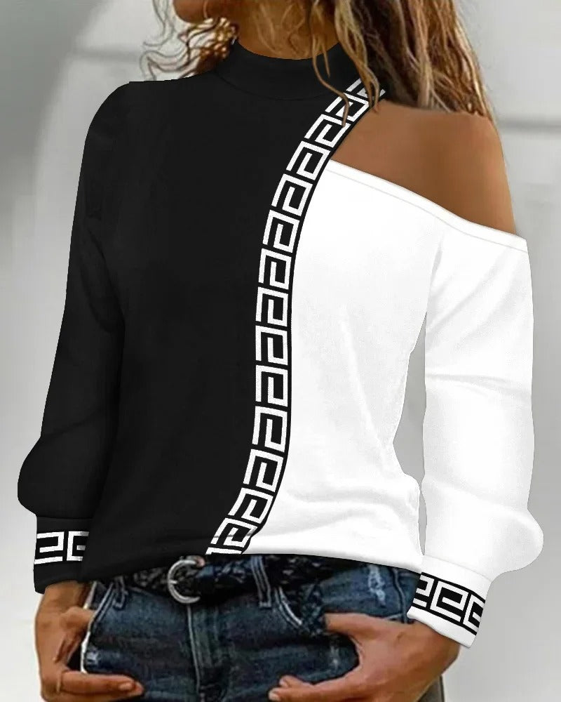 Lova svart damblus med patchworkmönster