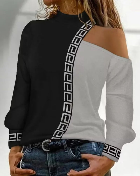 Lova svart damblus med patchworkmönster