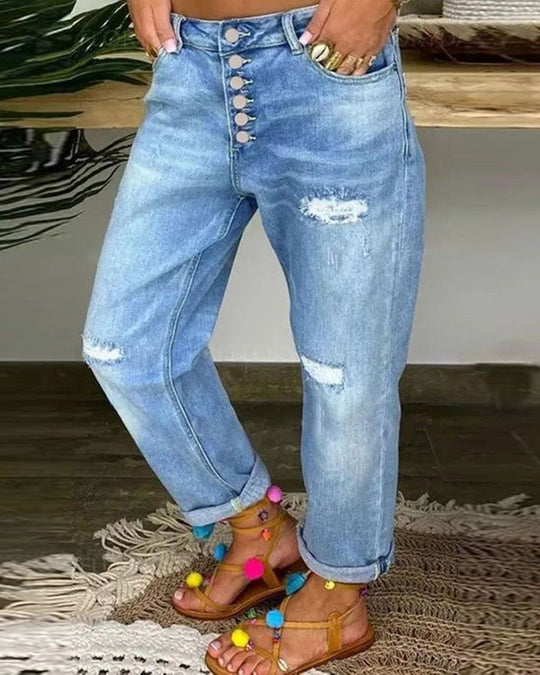 Slitna jeans med låg midja och knappar