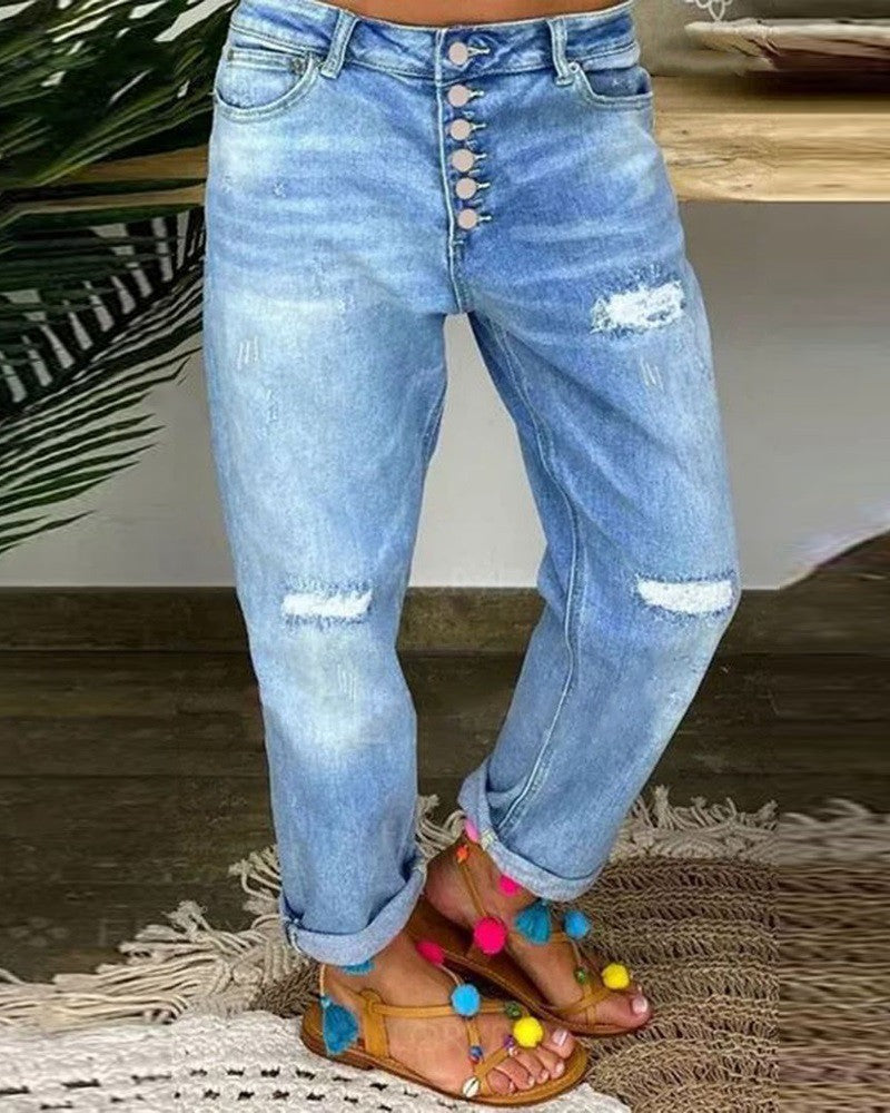 Slitna jeans med låg midja och knappar