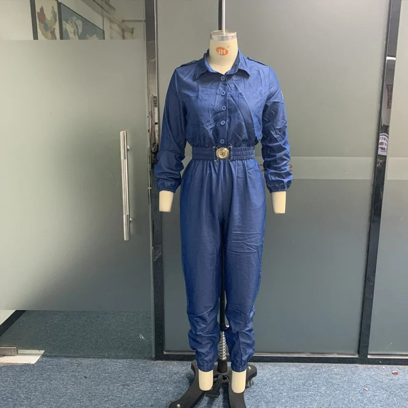 Blå V-ringad jumpsuit med elastisk midja, spänne och smala byxor