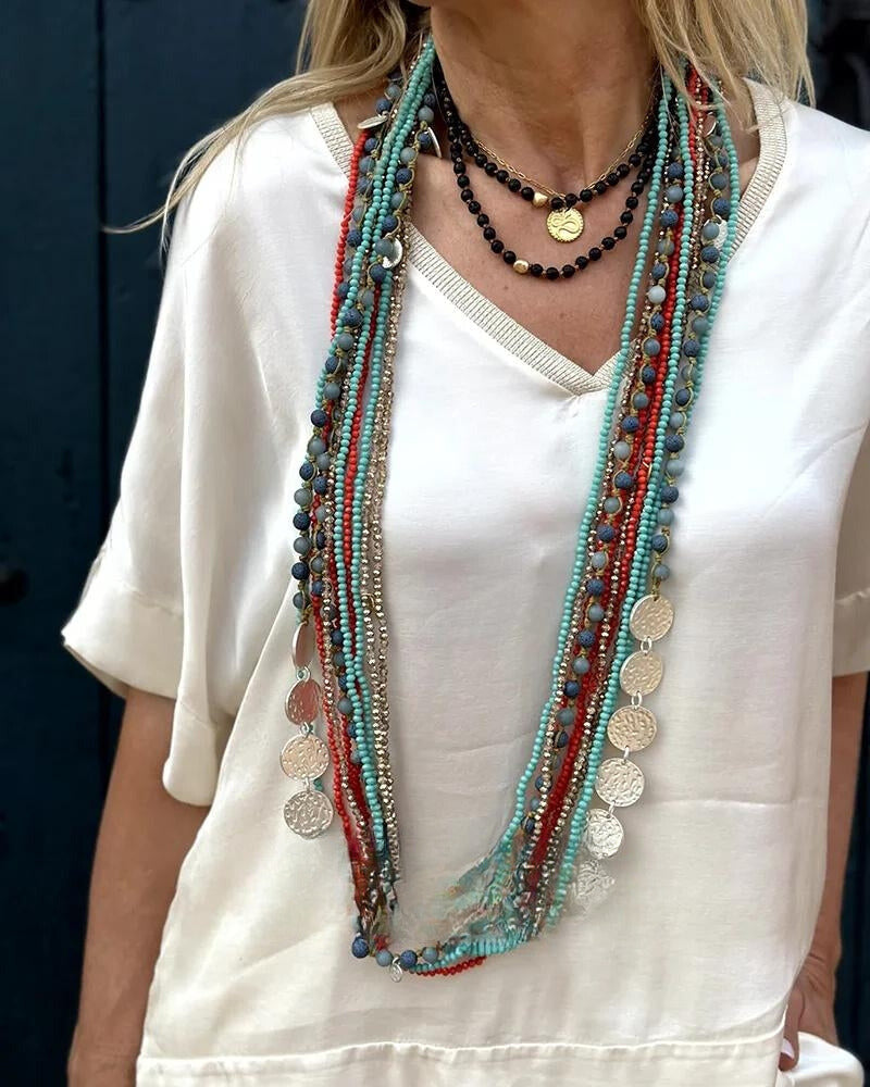 Elegant enfärgat set med blus och byxor